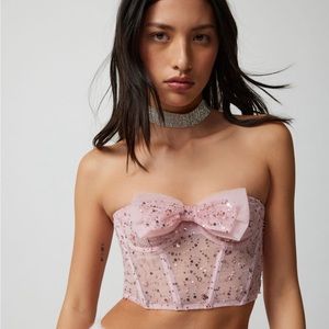 bow sequined corset top from urban outfitters. corset allows for flexible sizing